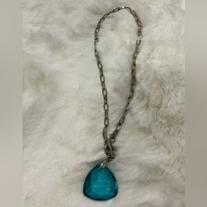 Sterling silver with blue heart shape gem